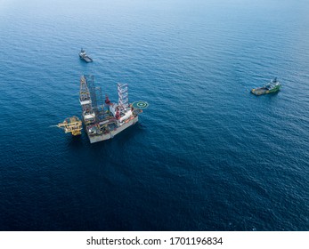 Aerial View Offshore Jack Up Rig And A Tow Vessel At The Offshore Location