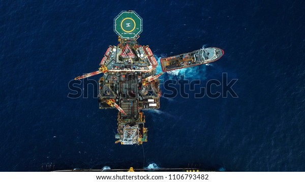 Aerial view of a offshore\
platform. Also known as an oil platform or offshore drilling rig is\
facilities to explore and process petroleum and natural\
gas.
