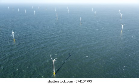 Aerial View Of Offshore Wind Turbine Farm In The Noordzee At Egmond Aan Zee, The Netherlands. The Project Is From Shell And Nuon.