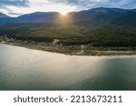 Aerial view of Ohrid-Prespa Transboundary Biosphere Reserve in National Park Galicica in North Macedonia, shore of Prespa lake in sunset
