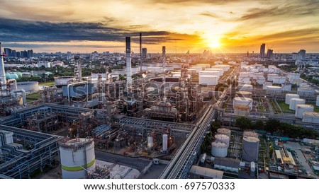 Aerial view of Oil and gas industry - refinery at sunset - factory - petrochemical plant, Shot from drone of Oil refinery and Petrochemical plant at dusk , Bangkok, Thailand