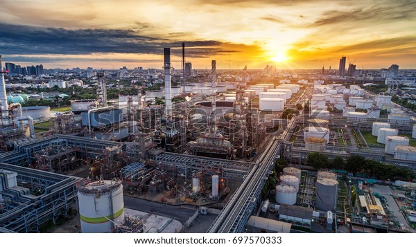 Aerial\
view of Oil and gas industry - refinery at sunset - factory -\
petrochemical plant, Shot from drone of Oil refinery and\
Petrochemical plant at dusk , Bangkok,\
Thailand