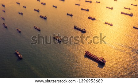 Aerial view oil and gas petrochemical tanker offshore in open sea, Refinery industry cargo ship, Oil product tanker and LPG tanker at sea view from above, Aerial view oil tanker ship at sunset.