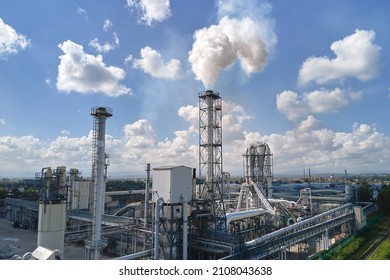 Aerial view of oil and gas refining petrochemical factory with high refinery plant manufacture structure. Global production and manufacturing concept.