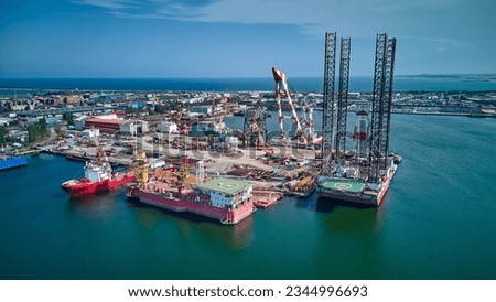 Aerial view of oil platforms anchored in the city harbor for repair.