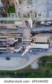 Aerial View Oil Refinery With A Lots Of Pielines At Sunset. Aerial Panorama. Top Down View.