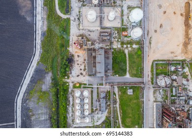 Aerial View Oil Refinery With A Lots Of Pielines At Sunset. Aerial Panorama. Top Down View.