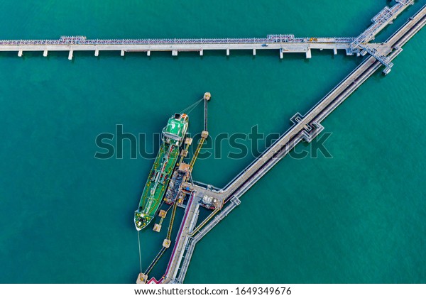 Aerial view\
oil tanker of business logistic sea going ship, Crude oil tanker\
lpg ngv at industrial estate Thailand / Group Oil tanker ship to\
Port of Singapore - import export\
