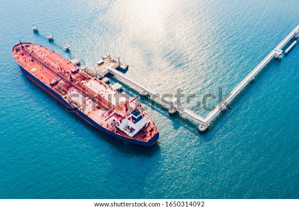 Aerial view oil
tanker of business logistic sea going ship, oil tanker ship lpg ngv
at industrial estate Thailand / Group Oil tanker ship to Port of
Singapore - import export
