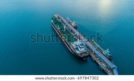 Aerial view oil tanker ship loading in port view from above, Tanker ship logistic import export business and transportation.