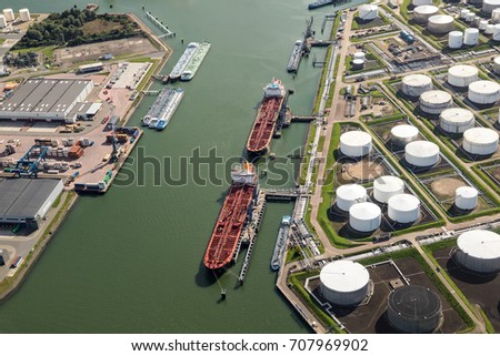 Aerial view of oil tankers moored at a oil storage terminal.