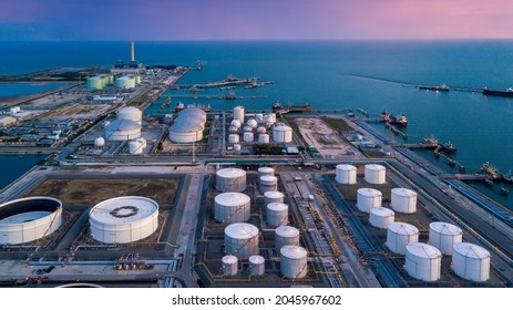 Aerial view oil terminal storage tank, White oil tank storage chemical petroleum petrochemical refinery product at oil terminal, Business commercial trade fuel energy transport by tanker ship vessel. - Shutterstock ID 2045967602