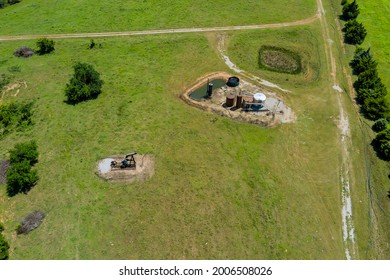 Aerial View In Oil Well Pump Jack Working Pump Jack Out In Field Of Grass With Of Oklahoma US