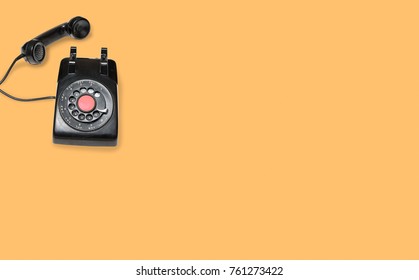 Aerial View Of Old And Antique Rotary Telephone On Orange Background