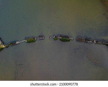 Aerial view of an old broken bridge found near La Case du Pecheur lodges which are located on the south-east coast of Mauritius island at Bambous Virieux