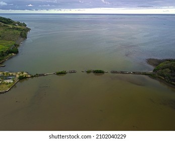 Aerial view of an old broken bridge found at a sea bay near La Case du Pecheur lodges which are located on the south-east coast of Mauritius island at Bambous Virieux