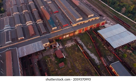 Aerial View. Old Defective And Looted Railway Wagons Stand On The Territory Of The Repair Depot Awaiting Repairs. Poor Business Management. Ukrainian Railway, DVRZ.