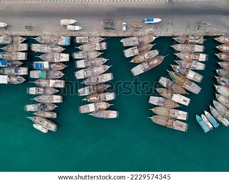Aerial view of old fishing boats by the shore in Abu Dhabi, UAE. High quality photo.