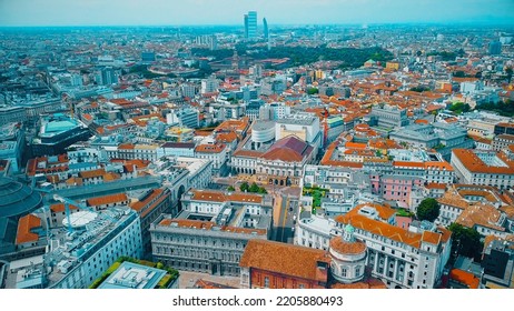 Aerial View Of The Old Square With A Monument To The Artist And Inventor Leonardo Da Vinci Next To The La Scala Opera House, The Comuna And The Vittorio Emmanuele Gallery In Milan Italy 09.2022