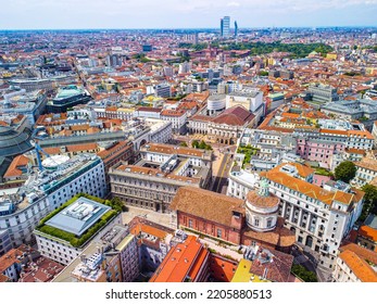 Aerial View Of The Old Square With A Monument To The Artist And Inventor Leonardo Da Vinci Next To The La Scala Opera House, The Comuna And The Vittorio Emmanuele Gallery In Milan Italy 09.2022