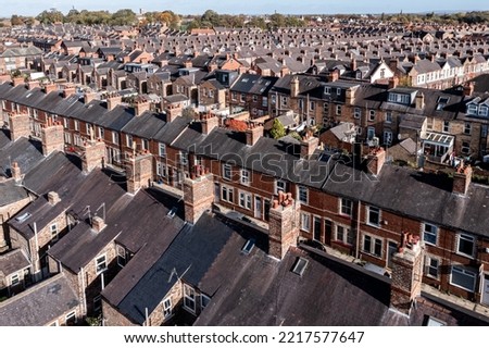 Aerial view of old terraced houses on back to back streets in the suburbs of a large UK city in the North of England