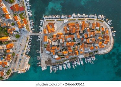 Aerial view of the old town of Tribunj on a small island in Adriatic sea, Dalmatia region of Croatia. Adriatic Town of Tribunj on small island. Historic buildings with cozy outdoor restaurants. - Powered by Shutterstock