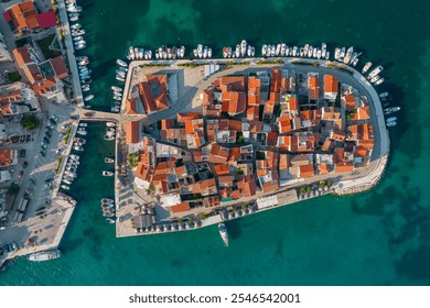 Aerial view of the old town of Tribunj on a small island in Adriatic sea, Dalmatia region of Croatia. Adriatic Town of Tribunj on small island. Historic buildings with cozy outdoor restaurants. - Powered by Shutterstock