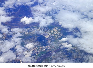 Aerial View Of The Omaha, Nebraska Eppley Airfield (OMA) Peering Through The Clouds