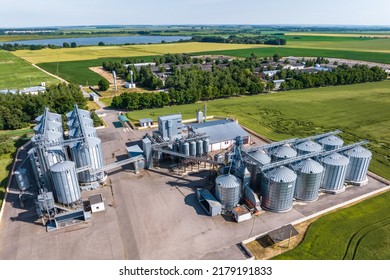 aerial view on agro silos granary elevator on agro-processing manufacturing plant for processing drying cleaning and storage of agricultural products, flour, cereals and grain. 