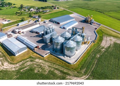 aerial view on agro silos granary elevator with seeds cleaning line on agro-processing manufacturing plant for processing drying cleaning and storage of agricultural products, flour and grain.  - Powered by Shutterstock