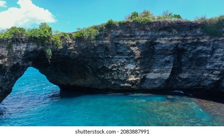 Aerial view on amazing Broken Beach Pasih Uug in Nusa Penida with natural arch, bridge and sea pool on background nature landscape. Bali, Indonesia. Shot at sunrise on Hasselblad.