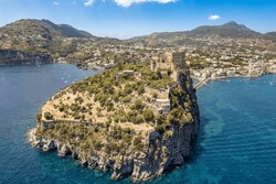 Aerial View On Aragonese Castle. The Castle Is The Most Impressive Historical Monument In Ischia, Build In 474 BC. Aerial View Of The Island And Town Of Ischia.