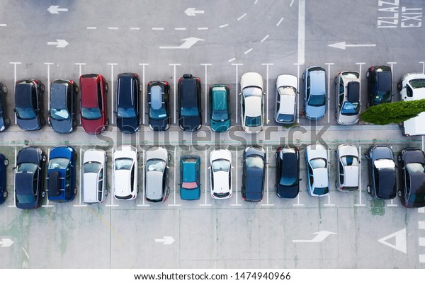 Aerial view on the cars\
on park place. View from drone on the carpark. Transportation\
background - image