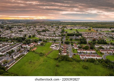 Aerial View On A City Residential Area With Houses And Park. Galway, Ireland. Blue Cloudy Sky. High Density Urban Land.