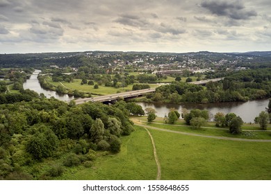 Aerial View On The City Of Witten Herbede In Germany With The River Ruhr And A Highway In Front