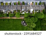 Aerial view on high density living area with houses built close to each other and park. Residential area in Ireland with private housing. City planning and developing concept.