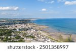 Aerial view on houses on coast of see in Newcastle, Northern Ireland. Coastal town, Drone photo