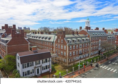 Aerial view on John F Kennedy Street in Harvard University Area in Cambridge, Massachusetts, the USA. Eliot House white belltower seen on the background. Tourists in the street