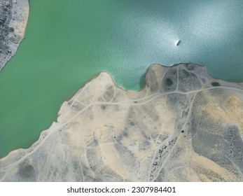 Aerial view on mountain lake. Drone view water reservoir at mountain valley. Beautiful view from above on smooth blue surface of mountain lake among highlands. Top view - Powered by Shutterstock