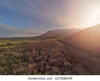 Aerial View On Mountains In County Sligo, Horse Shoe Ring, Sunrise Time, Sun Flare. Cloudy Sky.