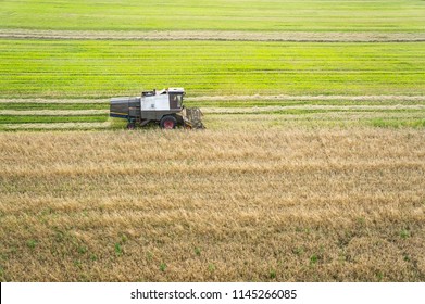 Aerial view on older combine harvester machine working in field. Agriculture view from above.  - Shutterstock ID 1145266085