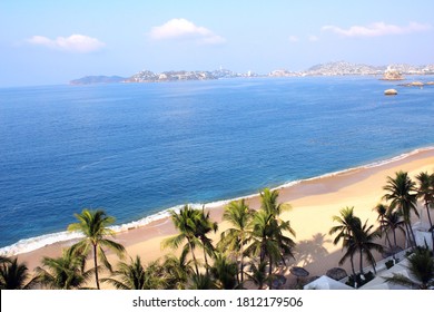 Aerial view on palms, ocean waves and beach, Acapulco de Juarez, Mexico, the Pacific Ocean, North America