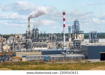 aerial view on pipes of chemical enterprise plant. Air pollution concept. Industrial landscape environmental pollution waste of thermal power plant