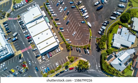 Aerial View On A Plaza With Parked Cars Surrounded By Commercial And Office Buildings And Residential Houses. Auckland, New Zealand.