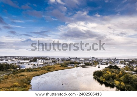 Aerial view on River Corrib and Galway city, Ireland. Warm sunny day with stunning cloudy sky. Irish nature landscape scene.