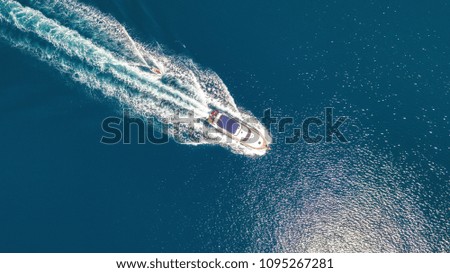 Similar – Aerial view of small boat in sea