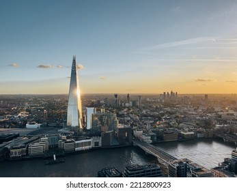 Aerial View On The Shard Tower In Central London With River Thames And Bridge During Sunset