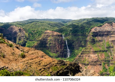 Aerial view on a sunny day over Waimea Canyon in Kauai, Hawaii - also known as The Grand Canyon of the Pacific - Shutterstock ID 1107086324
