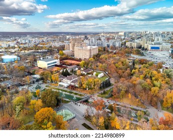 Aerial View On Vibrant Autumn Shevchenko City Garden With Fountains Near Historical Buildings. Tourist Attraction In Colorful Park, Rooftop In Kharkiv, Ukraine