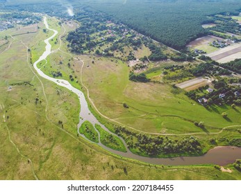 Aerial View On The Winding River In The Meadow